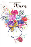 This Mother's Day card portrays a radiant, hand-painted bouquet, as if caught in the moment just after a florist in Brockley set down their brush. The flowers, while loosely defined, read as lush, full blooms: vivid purples and deep indigos swirl into playful pinks, ruby reds, and soft coral tones, suggesting layered petals gathered together in a joyful embrace. Here and there, gentle touches of gold outline parts of petals and leaves, adding a subtle metallic shimmer that gives the arrangement a celebratory feel, like sunlight glancing off a ribbon on a fresh delivery along Brockley Road. Flecks and splashes of colour surround the bouquet, reminiscent of petals tossed in the air or droplets of paint flicked from an enthusiastic brush, underlining the sense of movement and spontaneity. The blossoms rise from a softly curved vase at the base of the design, its form suggested by cool blue and lavender washes, with a refined golden detail that hints at a tied bow. The white background acts as a quiet stage, letting every hue glow with clarity and warmth. Despite its artistic looseness, the composition feels balanced and thoughtful, echoing the way a real florist carefully places each stem to create harmony. The card conveys gratitude, tenderness, and the joy of Mother's Day in SE4 - perfect for a mum who appreciates both flowers and art, and who might smile at the way this painted bouquet reflects the colourful, village-like charm of Brockley's streets and gardens.